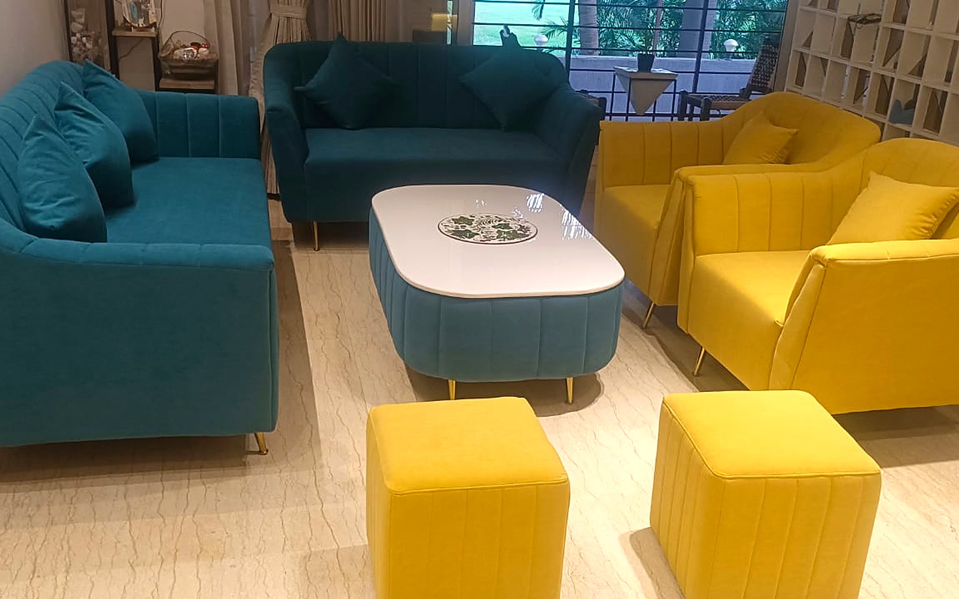 Custom teal and yellow sofa set made by Royal Decor for a living room in Surat
