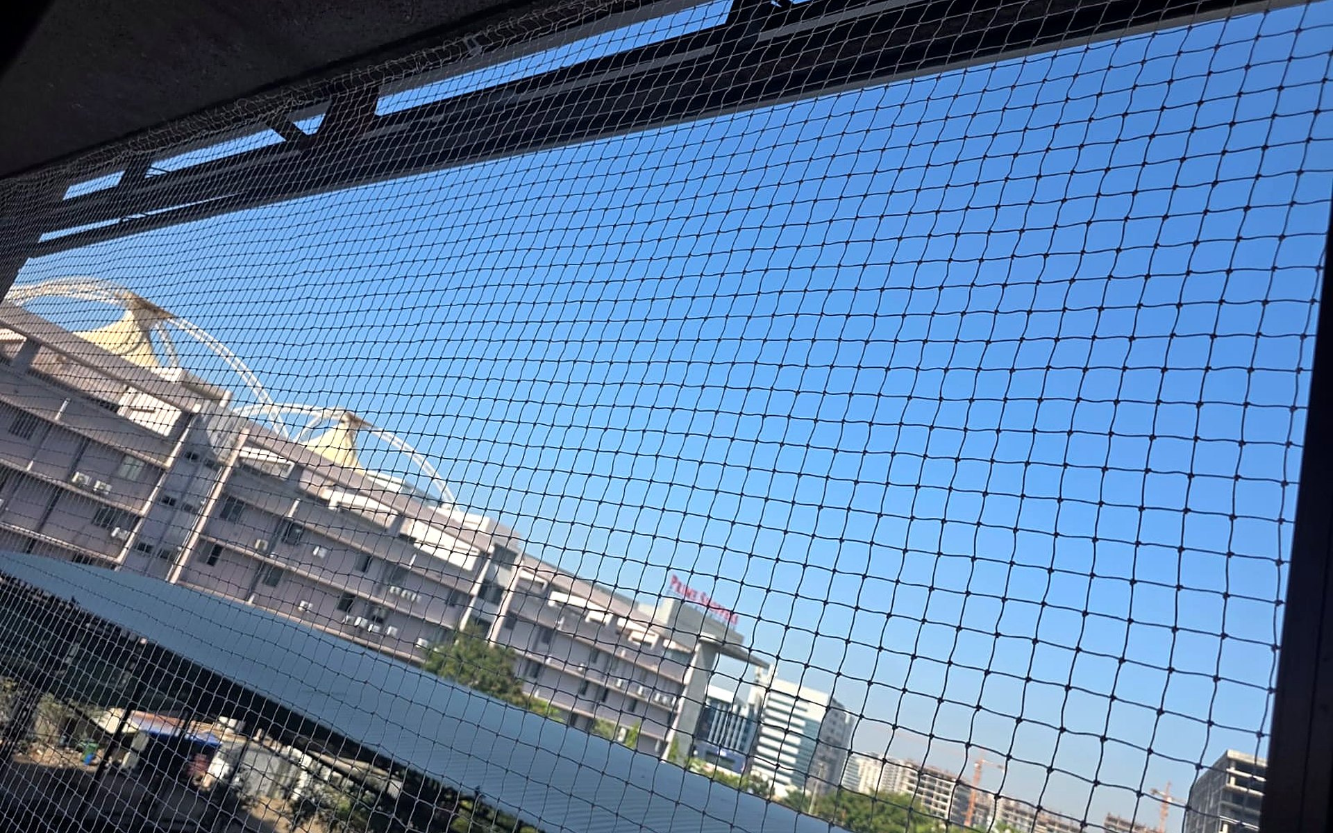 Pigeon net fitted on a Piplod high-rise balcony, Surat