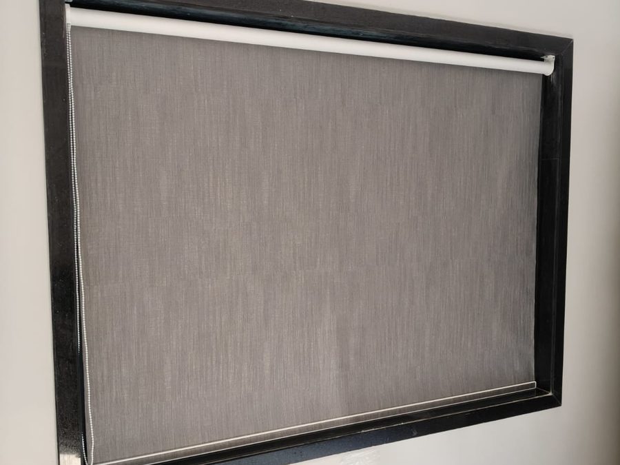 Textured roller blind above an upholstered backrest — Royal Decor, Vesu, Surat