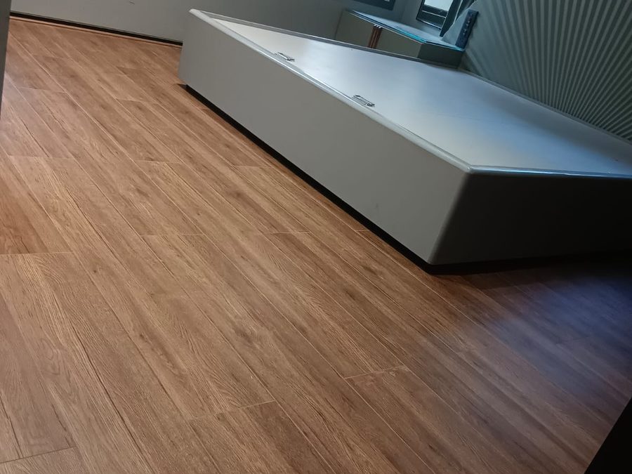 Wooden flooring across a full bedroom — Royal Decor, Vesu, Surat