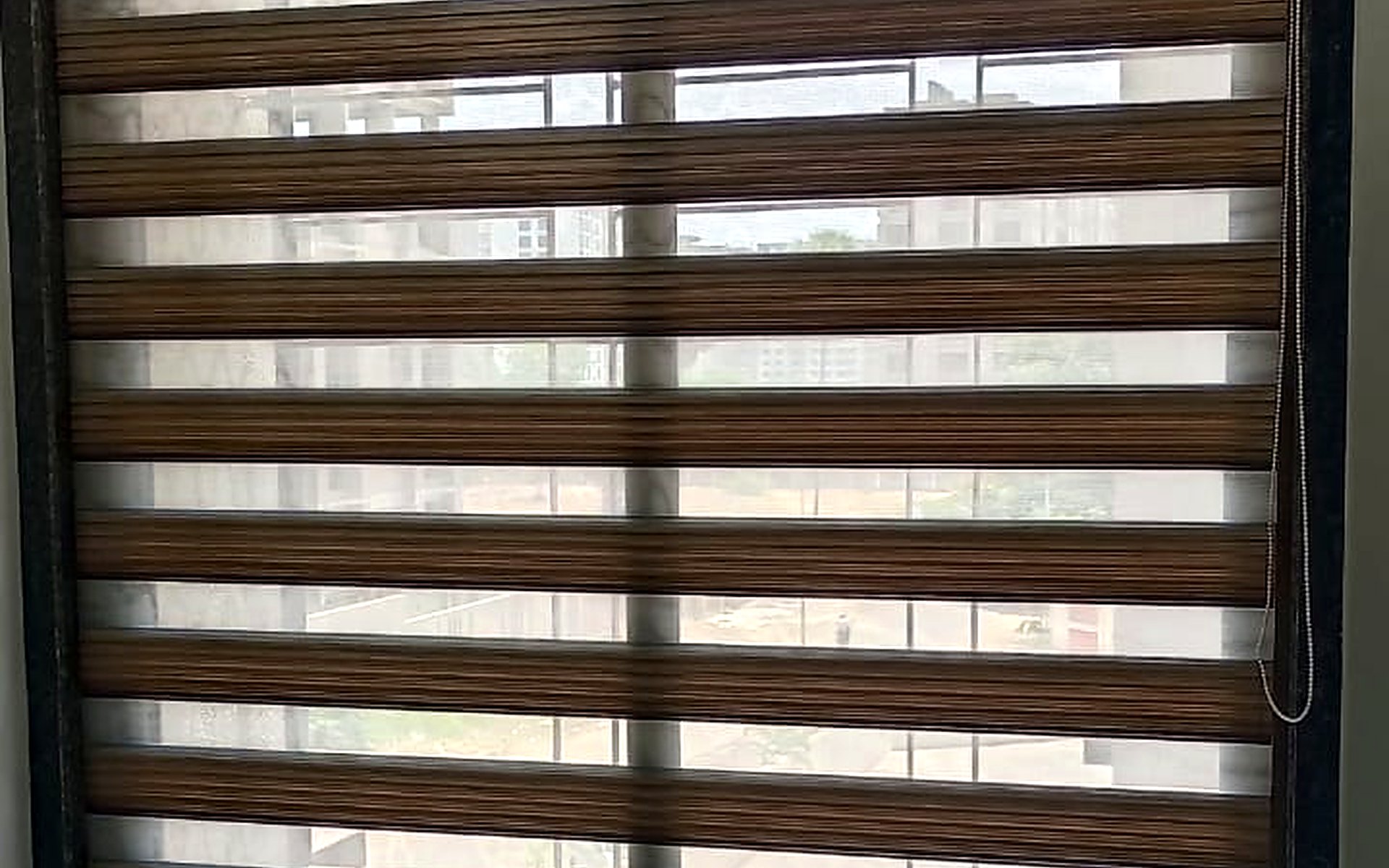 Zebra blinds installed in a bedroom window in Vesu, Surat by Royal Decor